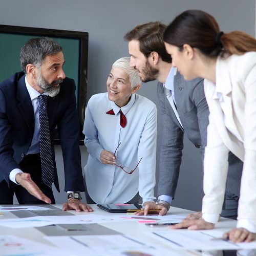 Creative business people working on business project in modern office
